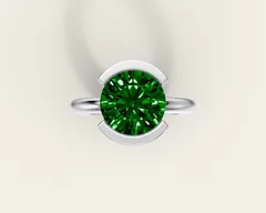 Emerald solitaire ring in 18k white gold