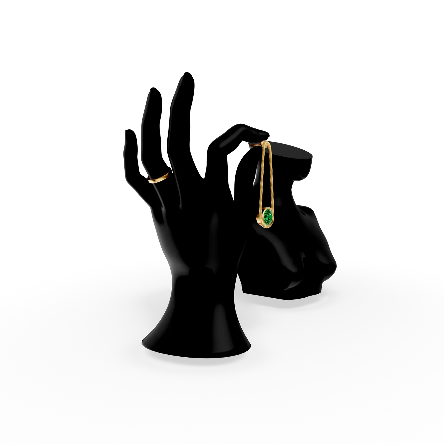 Mano de maniquí en blanco y negro que sostiene un pendiente colgante de oro y esmeralda: probador virtual de pendientes