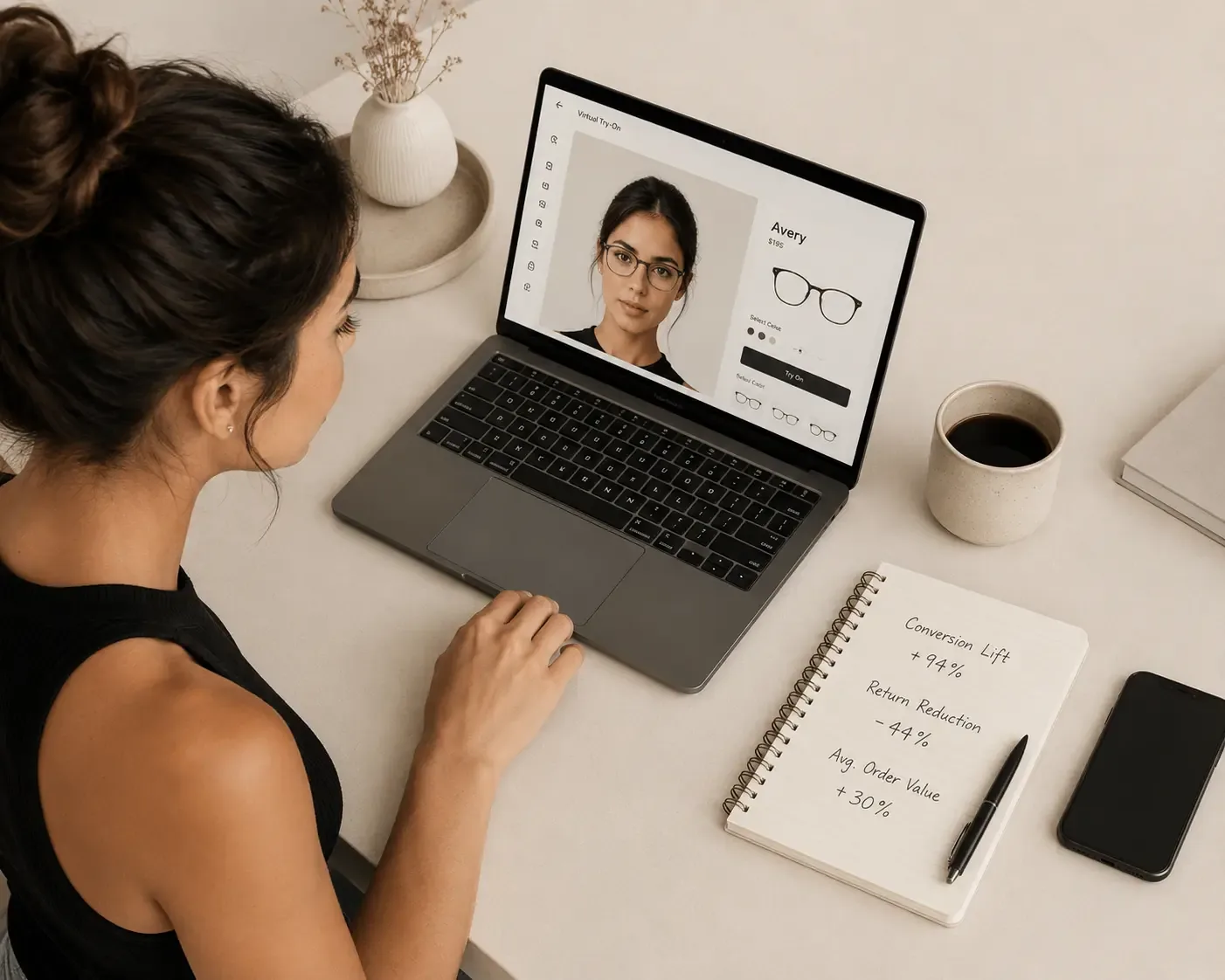 Retailer viewing a virtual try-on product page beside a notebook of quoted conversion statistics